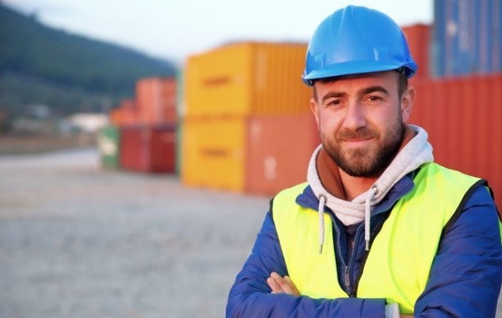 portrait of worker in container yard
