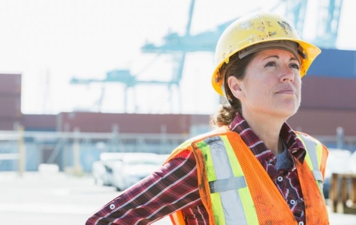 person in cargo terminal looking up