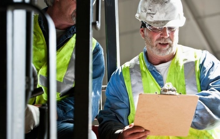 workers talking at a container yard