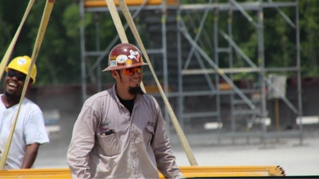 worker in hard hat on shipyard