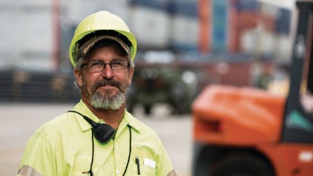 Man in hard hat on cargo yard
