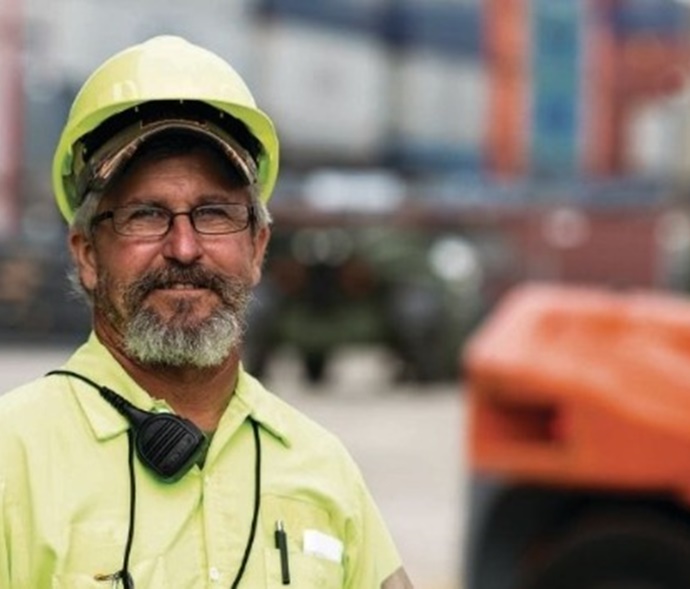 Man in hard hat on cargo yard