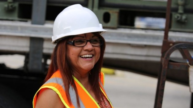 Woman in a hard hat smiling