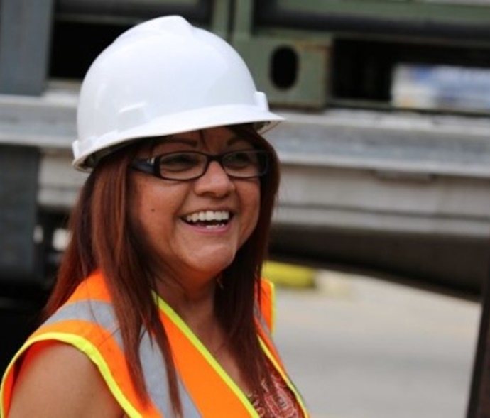 Woman in a hard hat smiling
