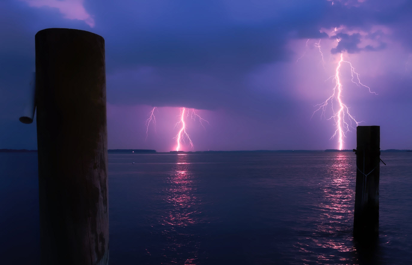 Lightning strikes over water