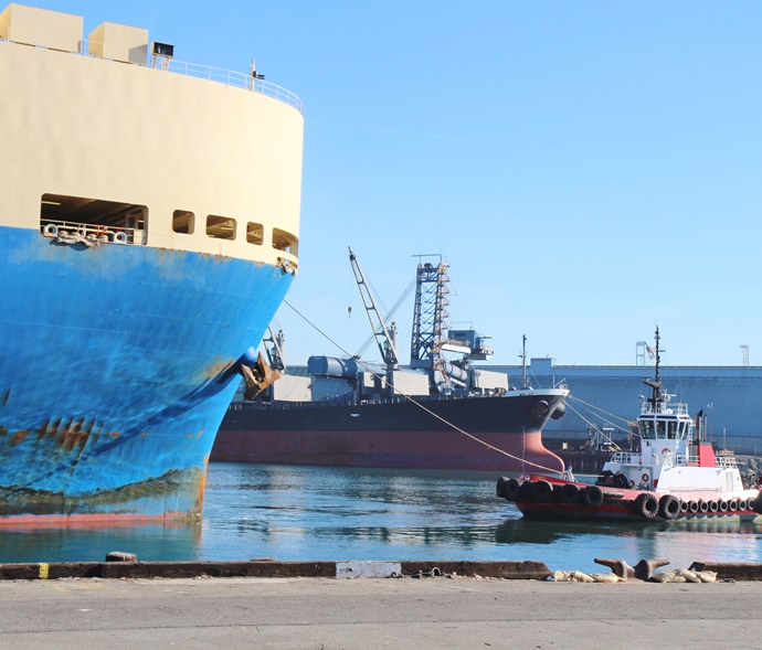 ship being towed into port