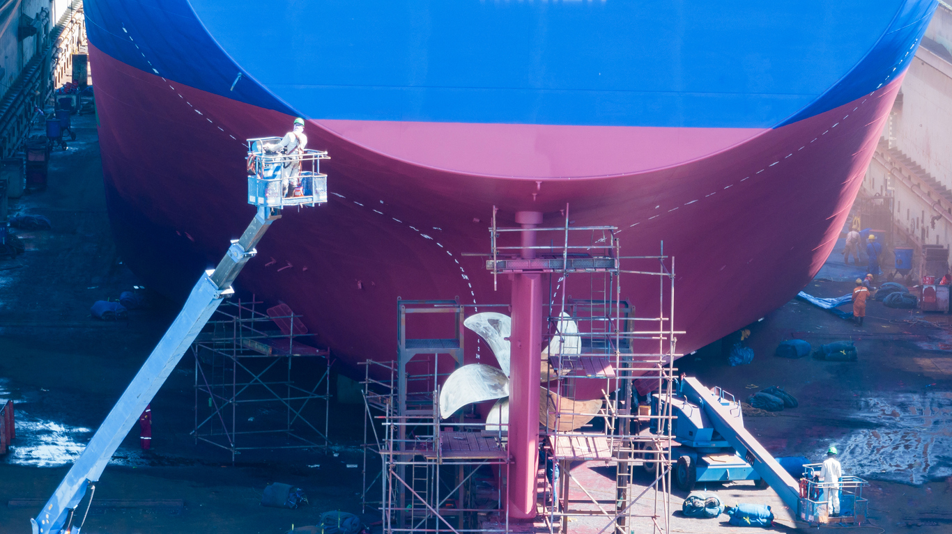 Painters painting a ship